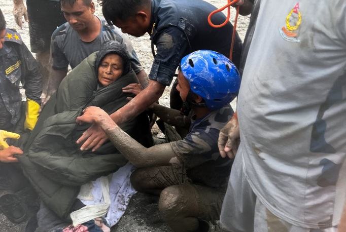 Death toll rises to 1,331 64-year-old woman rescued 10 days after floods in Nepal